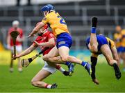 1 May 2022; Alan Connolly of Cork is tackled by Rory Hayes and John Conlon, right, of Clare during the Munster GAA Hurling Senior Championship Round 3 match between Cork and Clare at FBD Semple Stadium in Thurles, Tipperary. Photo by Ray McManus/Sportsfile