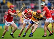 1 May 2022; John Conlon of Clare is tackled by Cork players, from left, Alan Connolly, Conor Lehane of Cork and Shane Kingston during the Munster GAA Hurling Senior Championship Round 3 match between Cork and Clare at FBD Semple Stadium in Thurles, Tipperary. Photo by Ray McManus/Sportsfile