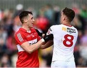 1 May 2022; Shane McGuigan of Derry and Conn Kilpatrick of Tyrone tussle during the Ulster GAA Football Senior Championship Quarter-Final match between Tyrone and Derry at O'Neills Healy Park in Omagh, Tyrone. Photo by David Fitzgerald/Sportsfile