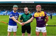 1 May 2022; Referee Colum Cunning with Laois captain Sean Downey, left, and Wexford captain Lee Chin before the Leinster GAA Hurling Senior Championship Round 3 match between Laois and Wexford at MW Hire O’Moore Park in Portlaoise, Laois. Photo by Michael P Ryan/Sportsfile