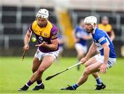 1 May 2022; Conor Devitt of Wexford in action against Ben Conroy of Laois during the Leinster GAA Hurling Senior Championship Round 3 match between Laois and Wexford at MW Hire O’Moore Park in Portlaoise, Laois. Photo by Michael P Ryan/Sportsfile