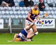 1 May 2022; Jack O'Connor of Wexford in action against Charles Dwyer of Laois during the Leinster GAA Hurling Senior Championship Round 3 match between Laois and Wexford at MW Hire O’Moore Park in Portlaoise, Laois. Photo by Michael P Ryan/Sportsfile