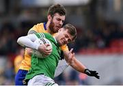 30 April 2022; Brian Donovan of Limerick in action against Manus Doherty of Clare during the Munster GAA Senior Football Championship Quarter-Final match between Clare and Limerick at Cusack Park in Ennis, Clare. Photo by Piaras Ó Mídheach/Sportsfile