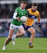 30 April 2022; Brian Donovan of Limerick in action against Manus Doherty of Clare during the Munster GAA Senior Football Championship Quarter-Final match between Clare and Limerick at Cusack Park in Ennis, Clare. Photo by Piaras Ó Mídheach/Sportsfile