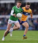 30 April 2022; Brian Donovan of Limerick in action against Manus Doherty of Clare during the Munster GAA Senior Football Championship Quarter-Final match between Clare and Limerick at Cusack Park in Ennis, Clare. Photo by Piaras Ó Mídheach/Sportsfile