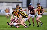 2 May 2022; Seánie McDonagh of Galway is tackled by Billy Reid, right, and Paddy Langton of Kilkenny during the oneills.com Leinster GAA Hurling Under 20 Championship Semi-Final match between Kilkenny and Galway at O'Connor Park in Tullamore, Offaly. Photo by Ben McShane/Sportsfile