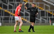 1 May 2022; Referee David Gough shows a yellow card to Niall Sharkey of Louth during the Leinster GAA Football Senior Championship Quarter-Final match between Kildare and Louth at O'Connor Park in Tullamore, Offaly. Photo by Seb Daly/Sportsfile