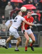 1 May 2022; Conor Early of Louth in action against Mick O’Grady of Kildare during the Leinster GAA Football Senior Championship Quarter-Final match between Kildare and Louth at O'Connor Park in Tullamore, Offaly. Photo by Seb Daly/Sportsfile