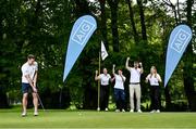 3 May 2022; Dublin footballer Cormac Costello putts, watched by, from left, Rachael McDonell, Dublin ladies footballer Sinéad Aherne, James Kelly and Louise Mernagh at the launch of this year's AIG Men's and Women's Cups and Shields and AIG Men's and Women's Irish Amateur Close Championships at Elm Park Golf Club in Dublin. AIG also revealed online discounted offers on new car and home insurance policies for Golf Ireland members - for more details go to www.aig.ie/golfer or call 1800407407. Photo by David Fitzgerald/Sportsfile
