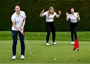 3 May 2022; Dublin ladies footballer Sinéad Aherne putts, watched by golfers Louise Mernagh, left, and Rachael McDonell at the launch of this year's AIG Men's and Women's Cups and Shields and AIG Men's and Women's Irish Amateur Close Championships at Elm Park Golf Club in Dublin. AIG also revealed online discounted offers on new car and home insurance policies for Golf Ireland members - for more details go to www.aig.ie/golfer or call 1800407407. Photo by David Fitzgerald/Sportsfile
