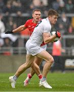 1 May 2022; Kevin Feely of Kildare in action against Conor Grimes of Louth during the Leinster GAA Football Senior Championship Quarter-Final match between Kildare and Louth at O'Connor Park in Tullamore, Offaly. Photo by Seb Daly/Sportsfile