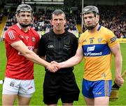 1 May 2022; Referee Paud O'Dwyer with the two captains, Mark Coleman of Cork and Tony Kelly of Clare, during the Munster GAA Hurling Senior Championship Round 3 match between Cork and Clare at FBD Semple Stadium in Thurles, Tipperary. Photo by Ray McManus/Sportsfile