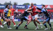 29 April 2022; Simon Zebo of Munster is tackled by Kristian Dacey and Owen Lane of Cardiff Blues during the United Rugby Championship match between Munster and Cardiff at Musgrave Park in Cork. Photo by Brendan Moran/Sportsfile