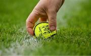 1 May 2022; A sliotar is picked from the grass during the Munster GAA Hurling Senior Championship Round 3 match between Cork and Clare at FBD Semple Stadium in Thurles, Tipperary. Photo by Ray McManus/Sportsfile