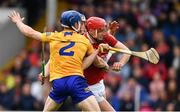 1 May 2022; Alan Connolly of Cork is tackled by Clare players, from left, Rory Hayes and Diarmuid Ryan before going on to score a goal during the Munster GAA Hurling Senior Championship Round 3 match between Cork and Clare at FBD Semple Stadium in Thurles, Tipperary. Photo by Ray McManus/Sportsfile