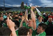 4 May 2022; Limerick captain Jimmy Quilty and teammates celebrate with the trophy after their side's victory in oneills.com Munster GAA Hurling U20 Championship Final match between Limerick and Tipperary at TUS Gaelic Grounds in Limerick. Photo by Seb Daly/Sportsfile