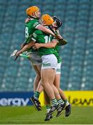 4 May 2022; Limerick players, from left, Patrick Reale, Adam English and Ethan Hurley celebrate after their side's victory in the oneills.com Munster GAA Hurling U20 Championship Final match between Limerick and Tipperary at TUS Gaelic Grounds in Limerick. Photo by Seb Daly/Sportsfile