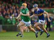 4 May 2022; Adam English of Limerick in action against James Armstrong of Tipperary during the oneills.com Munster GAA Hurling U20 Championship Final match between Limerick and Tipperary at TUS Gaelic Grounds in Limerick. Photo by Seb Daly/Sportsfile