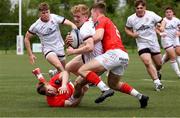 6 May 2022; Conor McKee of Ulster is tackled by Paddy Patterson of Munster during the 'A' Interprovincial between Munster and Ulster at  University of Limerick in Limerick. Ireland Photo by John Dickson/Dicksondigital