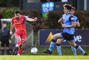 6 May 2022; Patrick Hoban of Dundalk has a shot on goal despite the attention of Dara Keane of UCD during the SSE Airtricity League Premier Division match between UCD and Dundalk at UCD Bowl in Belfield, Dublin. Photo by Ben McShane/Sportsfile