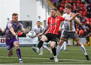 6 May 2022; Jamie McGonigle of Derry City in action against Bohemians goalkeeper James Talbot and Sam Packham, right, during the SSE Airtricity League Premier Division match between Derry City and Bohemians at The Ryan McBride Brandywell Stadium in Derry. Photo by Stephen McCarthy/Sportsfile