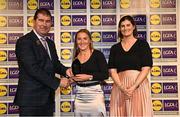 6 May 2022; The 2022 Teams of the Lidl Ladies National Football League awards were presented at Croke Park on Friday, May 6. The best players from the four divisions in the Lidl National Football Leagues were selected by the LGFA’s All Star committee. Niamh McLaughlin of Donegal pictured receiving her Division 1 award from President of the LGFA Mícheál Naughton, and Aoife Clarke, Communications and CSR Director, Lidl Ireland. Photo by Ramsey Cardy/Sportsfile