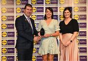 6 May 2022; The 2022 Teams of the Lidl Ladies National Football League awards were presented at Croke Park on Friday, May 6. The best players from the four divisions in the Lidl National Football Leagues were selected by the LGFA’s All Star committee. Nicole McLaughlin of Donegal pictured receiving her Division 1 award from President of the LGFA Mícheál Naughton, and Aoife Clarke, Communications and CSR Director, Lidl Ireland. Photo by Ramsey Cardy/Sportsfile