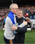 1 May 2022; Clare manager Brian Lohan is congratulated by Clare county board secretary Pat Fitzgerald after the Munster GAA Hurling Senior Championship Round 3 match between Cork and Clare at FBD Semple Stadium in Thurles, Tipperary.