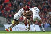 7 May 2022; Jack O'Donoghue of Munster is tackled by Rynhardt Elstadt, left, and Romain Ntamack of Toulouse during the Heineken Champions Cup Quarter-Final match between Munster and Toulouse at Aviva Stadium in Dublin. Photo by Ramsey Cardy/Sportsfile