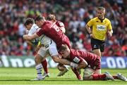 7 May 2022; Antoine Dupont of Toulouse is tackled by Alex Kendellen and Jack O’Donoghue of Munster during the Heineken Champions Cup Quarter-Final match between Munster and Toulouse at Aviva Stadium in Dublin. Photo by Brendan Moran/Sportsfile