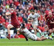 7 May 2022; Thomas Ahern of Munster is tackled by David Ainu'u of Toulouse during the Heineken Champions Cup Quarter-Final match between Munster and Toulouse at Aviva Stadium in Dublin. Photo by Ramsey Cardy/Sportsfile