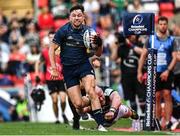 7 May 2022; Hugo Keenan of Leinster evades the tackle of Dan Cole of Leicester Tigers during the Heineken Champions Cup Quarter-Final match between Leicester Tigers and Leinster at Mattoli Woods Welford Road Stadium in Leicester, England. Photo by Harry Murphy/Sportsfile