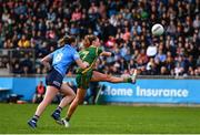 7 May 2022; Aoibhín Cleary of Meath kicks a point under pressure from Jennifer Dunne of Dublin during the TG4 Leinster Senior Ladies Football Championship Round 2 match between Dublin and Meath at Parnell Park in Dublin. Photo by Sam Barnes/Sportsfile