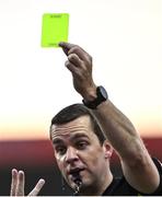 29 April 2022; Referee Rob Harvey shows a yellow card during the SSE Airtricity League Premier Division match between Sligo Rovers and Shamrock Rovers at The Showgrounds in Sligo. Photo by Piaras Ó Mídheach/Sportsfile