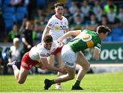 8 May 2022; Cillian Burke of Kerry is tackled by Brian Conway of Tyrone during the EirGrid GAA Football All-Ireland U20 Championship Semi-Final match between Kerry and Tyrone at MW Hire O'Moore Park in Portlaoise, Laois. Photo by Harry Murphy/Sportsfile
