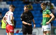8 May 2022; Referee Anthony Nolan tosses the coin watched by Tyrone captain Niall Devlin and Kerry captain Seán O'Brien before the EirGrid GAA Football All-Ireland U20 Championship Semi-Final match between Kerry and Tyrone at MW Hire O'Moore Park in Portlaoise, Laois. Photo by Harry Murphy/Sportsfile