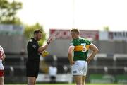 8 May 2022; Referee Anthony Nolan apologises to Alan Dineen of Kerry for mistakenly showing him a red card instead of a black card during the EirGrid GAA Football All-Ireland U20 Championship Semi-Final match between Kerry and Tyrone at MW Hire O'Moore Park in Portlaoise, Laois. Photo by Harry Murphy/Sportsfile