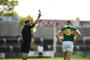 8 May 2022; Referee Anthony Nolan gives Alan Dineen of Kerry a black card after mistakenly showing him a red card during the EirGrid GAA Football All-Ireland U20 Championship Semi-Final match between Kerry and Tyrone at MW Hire O'Moore Park in Portlaoise, Laois. Photo by Harry Murphy/Sportsfile
