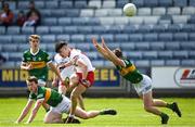 8 May 2022; Conor Cush of Tyrone scores a point despite the attention of Enda O'Connor of Kerry during the EirGrid GAA Football All-Ireland U20 Championship Semi-Final match between Kerry and Tyrone at MW Hire O'Moore Park in Portlaoise, Laois. Photo by Harry Murphy/Sportsfile