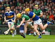 8 May 2022; Tom Morrisey of Limerick is tackled by Conor Stakelum of Tipperary  during the Munster GAA Hurling Senior Championship Round 3 match between Limerick and Tipperary at TUS Gaelic Grounds in Limerick. Photo by Ray McManus/Sportsfile