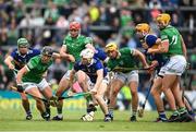 8 May 2022; Darragh O'Donovan of Limerick in action against Noel McGrath, left, and Paul Flynn of Tipperary during the Munster GAA Hurling Senior Championship Round 3 match between Limerick and Tipperary at TUS Gaelic Grounds in Limerick. Photo by Stephen McCarthy/Sportsfile