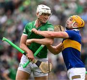 8 May 2022; Ronan Maher of Tipperary and Kyle Hayes of Limerick get up close and personal during the Munster GAA Hurling Senior Championship Round 3 match between Limerick and Tipperary at TUS Gaelic Grounds in Limerick. Photo by Ray McManus/Sportsfile