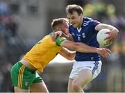 8 May 2022; Gearóid McKiernan of Cavan in action against Caolan Ward of Donegal during the Ulster GAA Football Senior Championship Semi-Final match between Cavan and Donegal at St Tiernach's Park in Clones, Monaghan. Photo by Piaras Ó Mídheach/Sportsfile