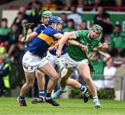 8 May 2022; Sean Finn of Limerick is tackled by Conor Bowe of Tipperary during the Munster GAA Hurling Senior Championship Round 3 match between Limerick and Tipperary at TUS Gaelic Grounds in Limerick. Photo by Ray McManus/Sportsfile