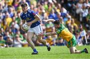 8 May 2022; James Smith of Cavan in action against Ryan McHugh of Donegal during the Ulster GAA Football Senior Championship Semi-Final match between Cavan and Donegal at St Tiernach's Park in Clones, Monaghan. Photo by Piaras Ó Mídheach/Sportsfile