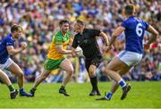 8 May 2022; Patrick McBrearty of Donegal gets away from Killian Brady of Cavan, left, as referee Conor Lane moves out of the way during the Ulster GAA Football Senior Championship Semi-Final match between Cavan and Donegal at St Tiernach's Park in Clones, Monaghan. Photo by Piaras Ó Mídheach/Sportsfile