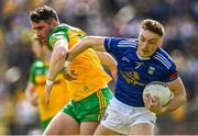 8 May 2022; Conor Brady of Cavan in action against Patrick McBrearty of Donegal during the Ulster GAA Football Senior Championship Semi-Final match between Cavan and Donegal at St Tiernach's Park in Clones, Monaghan. Photo by Piaras Ó Mídheach/Sportsfile