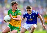 8 May 2022; Peader Mogan of Donegal in action against Cormac O'Reilly of Cavan during the Ulster GAA Football Senior Championship Semi-Final match between Cavan and Donegal at St Tiernach's Park in Clones, Monaghan. Photo by Piaras Ó Mídheach/Sportsfile