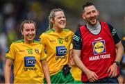 8 May 2022; Donegal players Blathnaid McLaughlin, 13, and Yvonne Bonnar share a joke with selector Mark McHugh after their side's victory in the Ulster Ladies Football Senior Championship Semi-Final match between Cavan and Donegal at St Tiernach's Park in Clones, Monaghan. Photo by Piaras Ó Mídheach/Sportsfile
