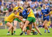 8 May 2022; Aisling Gilsenan of Cavan in action against Donegal players, from left, Niamh Carr, Evelyn McGinley, Shelly Twohig and Nicole McLaughlin during the Ulster Ladies Football Senior Championship Semi-Final match between Cavan and Donegal at St Tiernach's Park in Clones, Monaghan. Photo by Piaras Ó Mídheach/Sportsfile